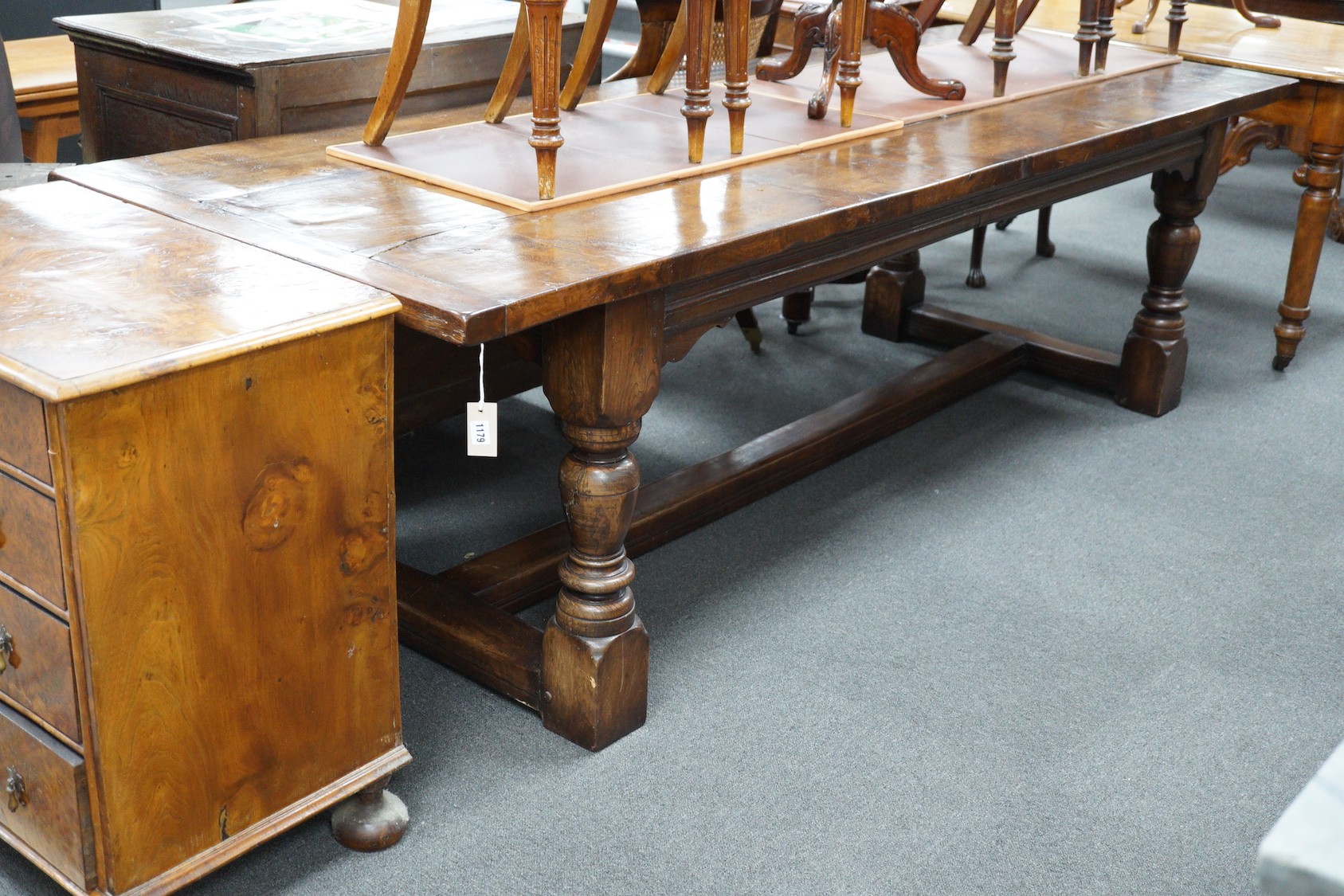 An 18th century style plank top rectangular oak refectory table, length 259cm, width 90cm, height 75cm